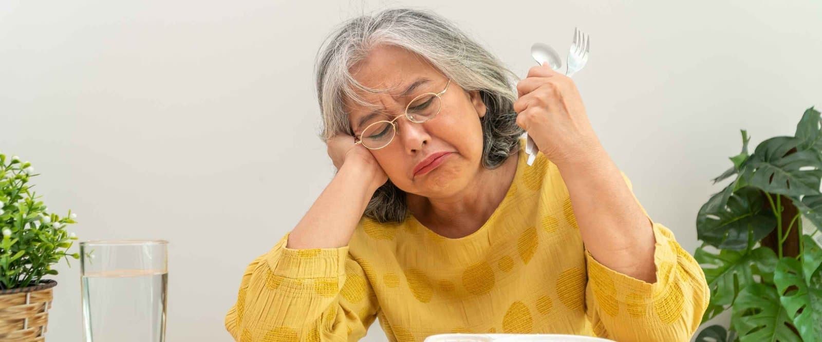 An older adult considering nutritious food choices.