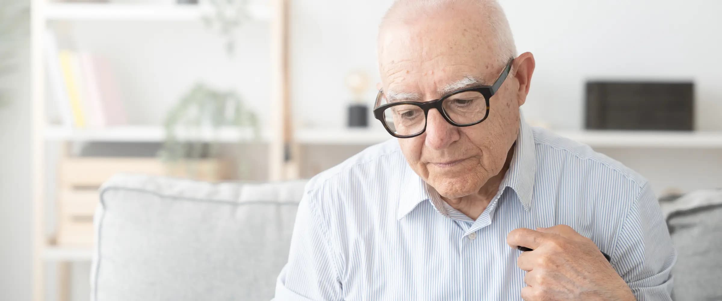 An older adult and relative discussing personality changes.