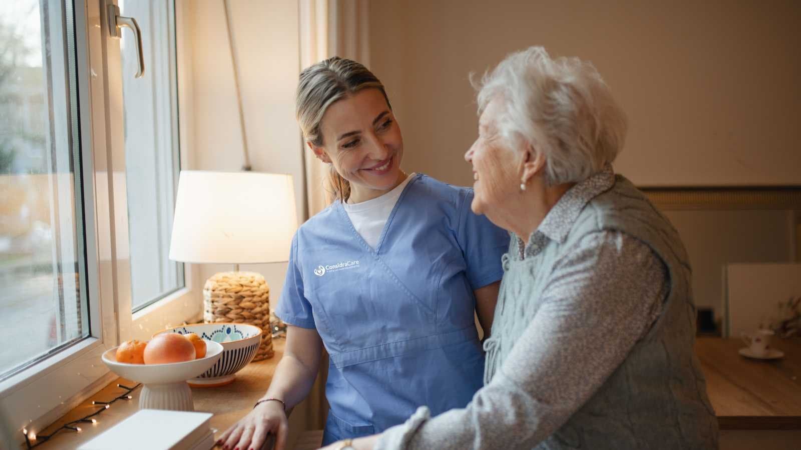 A family caregiver supporting an older adult with Alzheimer disease.