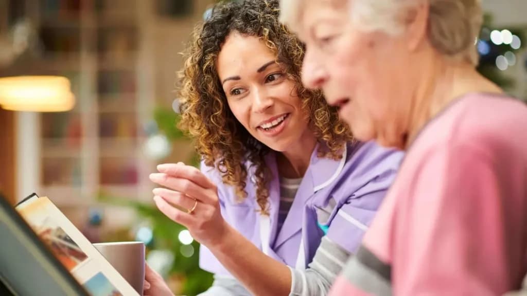 A caregiver calmly responding to dementia-related distress.