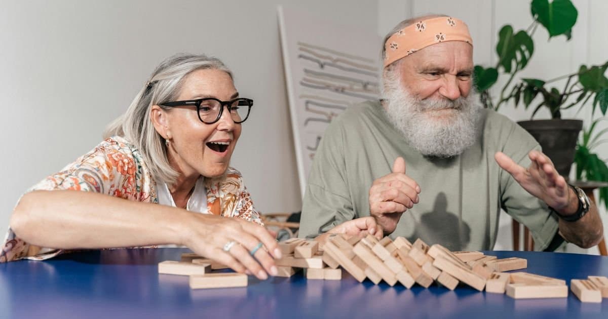 Older adults enjoying dementia-friendly games together.