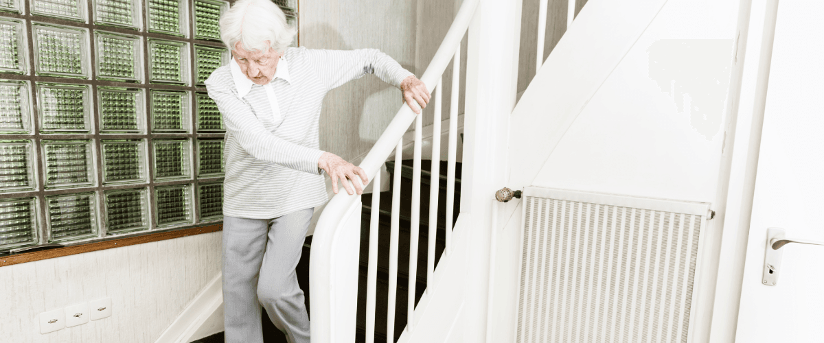 A family caregiver checking a home for fall risks.