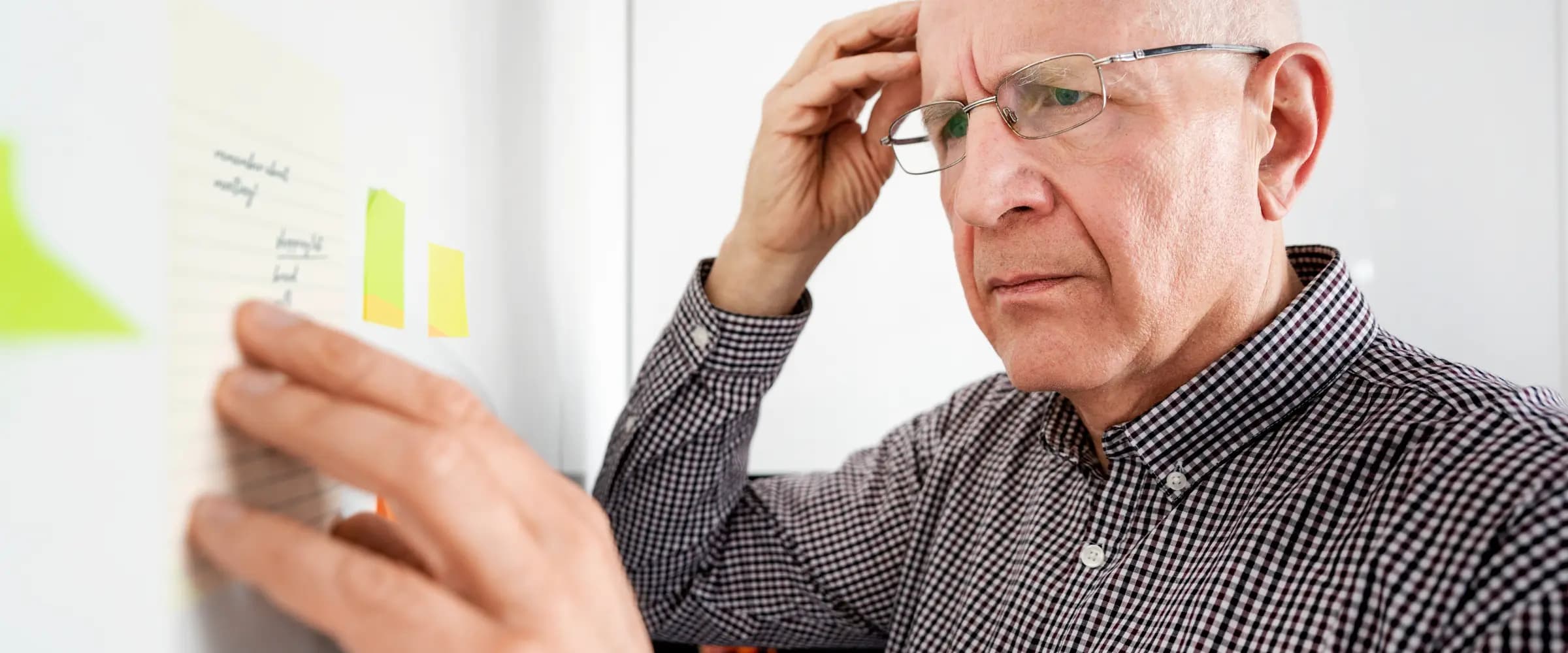 An older adult using a digital health coaching device.